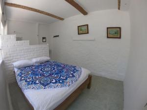 Postel nebo postele na pokoji v ubytování Hotel Jasayma dentro del Parque Tayrona