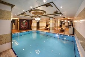 a large swimming pool in a hotel room at Great Fortune Hotel & Spa in Istanbul