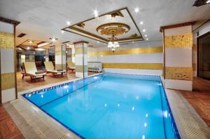 a large swimming pool in a hotel room at Great Fortune Hotel & Spa in Istanbul