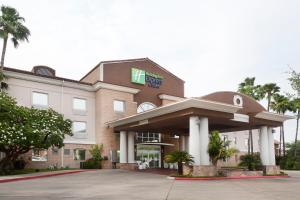 a hotel with a sign on the front of it at Holiday Inn Express Hotel and Suites Brownsville, an IHG Hotel in Brownsville