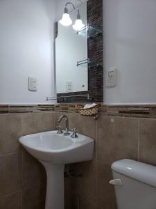 Ванная комната в Departamentos Temporarios Reggiardo