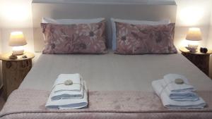 A bed or beds in a room at Casa Noemi
