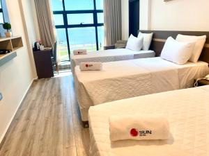Ліжко або ліжка в номері Hotel Sun