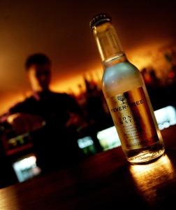 a bottle of alcohol sitting on top of a table at Boutique 25 in Skipton