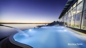 a bath tub in a building next to a body of water at Ferienwohnung Lakewinds in Meersburg