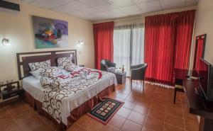 Postel nebo postele na pokoji v ubytování Hotel Monte Real