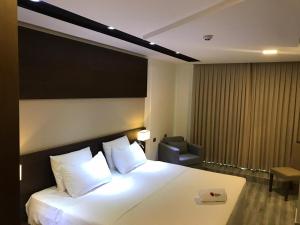 Ліжко або ліжка в номері Hotel Sun