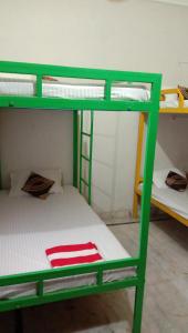 Cama o camas de una habitación en Good Vibes Hotel
