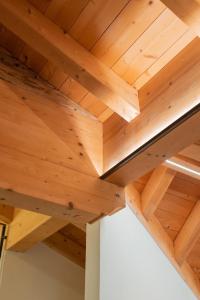 a wooden ceiling in a house at Pista Stelvio Loft Lumière in Bormio