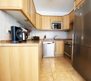 A kitchen or kitchenette at Penthouse 3 bedrooms, ocean view, near Siam Park
