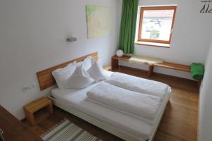 Posteľ alebo postele v izbe v ubytovaní aeki LOFT