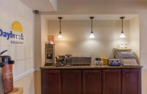 a kitchen with a counter with appliances on it at Days Inn by Wyndham Shenandoah in The Woodlands