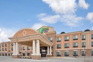 a hotel with a gazebo in front of a building at Holiday Inn Express Hays, an IHG Hotel in Hays