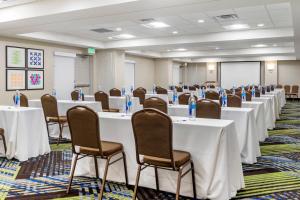 a conference room with white tables and chairs at Holiday Inn Express Hotel & Suites Albuquerque Midtown by IHG in Albuquerque +49 photos