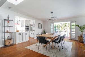 a kitchen and dining room with a table and chairs at Enchanting Sherman Oaks Home With Pool permit #HSR two one zero zero 2605 in Sherman Oaks