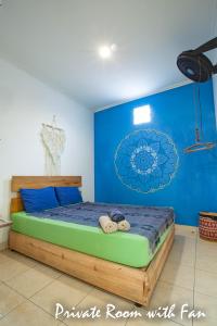 Tempat tidur dalam kamar di Happy Buddha Yogyakarta