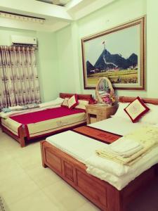 Giường trong phòng chung tại Hotel Thien An