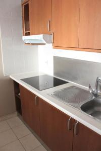 a kitchen with a sink and a counter top at Magnífico apartamento Playa Paraíso in Callao Salvaje