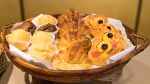 a basket filled with different types of pastries at Holiday Inn Express Port Moresby, an IHG Hotel in Port Moresby
