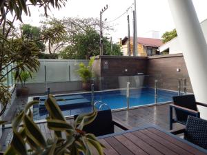 a view from the balcony of a house with a swimming pool at Apto. Novo e decorado. in Bombinhas