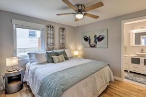 a bedroom with a bed with a ceiling fan at Dog-Friendly Ranch Retreat about 5 Mi to Denver! in Wheat Ridge