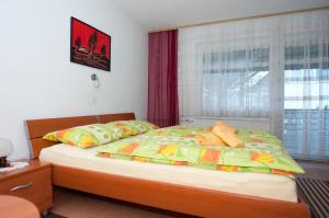 Postel nebo postele na pokoji v ubytování Apartments Mencinger
