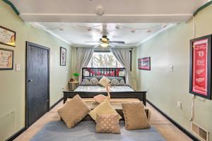 a child laying on a bed in a bedroom at Eclectic Escape with Sunroom - 2 Miles to Downtown! in Dearborn