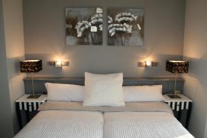 Postel nebo postele na pokoji v ubytování Hotel L'Ast + 24 fotografií