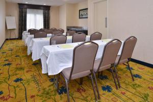 a conference room with rows of tables and chairs at Hampton Inn & Suites Cathedral City in Cathedral City +32 photos
