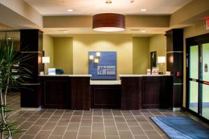 a lobby of a hotel with a reception desk at Holiday Inn Express and Suites Sikeston, an IHG Hotel in Sikeston