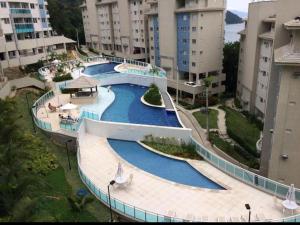an overhead view of a swimming pool in a building at Porto Real Suites Resort in Mangaratiba