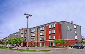a large brick building with a sign on it at Holiday Inn Express Hotel & Suites Cape Girardeau I-55 by IHG in Cape Girardeau