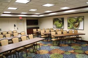 a classroom with tables and chairs in a room at Holiday Inn Express Hotel & Suites Cape Girardeau I-55, an IHG Hotel in Cape Girardeau