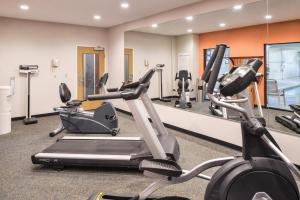a gym with two exercise bikes and a mirror at Holiday Inn Express Hotel & Suites Clifton Park, an IHG Hotel in Clifton Park