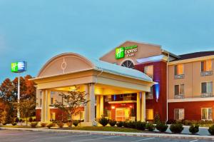 a hotel building with a sign on the front of it at Holiday Inn Express Hotel & Suites Dickson, an IHG Hotel in Dickson