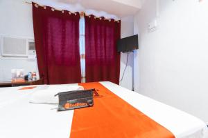 TV a/nebo společenská místnost v ubytování RedDoorz at Nirvana Pension House