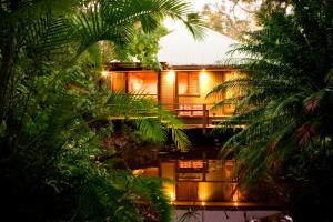 a house in the middle of a garden with trees at Hunchy Hideaway in Montville