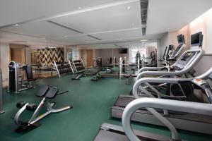 a gym with several treadmills and cardio machines at Holiday Inn & Suites Lanzhou Center, an IHG Hotel in Lanzhou