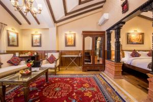 Voodi või voodid majutusasutuse Baber Mahal Vilas - The Heritage Hotel toas