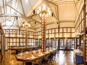 a large room with tables and chairs in it at Kurashiki Ivy Square in Kurashiki