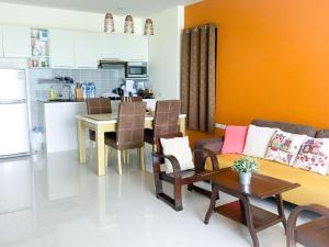 A seating area at Koh Sirey Beachfront Pool Villa