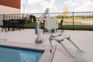a swing set next to a swimming pool at Holiday Inn Express & Suites Ruston, an IHG Hotel in Ruston