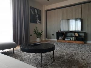 a living room with a tv and a coffee table at Top View Apartaments in Braşov