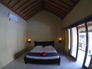 Cama o camas de una habitación en Indigenous Bungalow