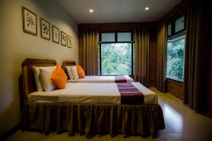 Säng eller sängar i ett rum på Malagos Garden Resort
