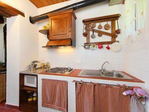 A kitchen or kitchenette at Apartment Piano Rosso 2 by Interhome
