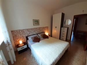 Posteľ alebo postele v izbe v ubytovaní Saglia Apartments