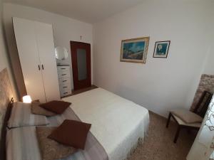 Posteľ alebo postele v izbe v ubytovaní Saglia Apartments