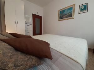 Posteľ alebo postele v izbe v ubytovaní Saglia Apartments