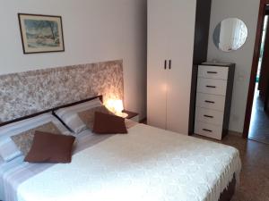 Posteľ alebo postele v izbe v ubytovaní Saglia Apartments
